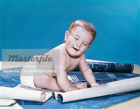 1960s BABY EYES CLOSED FUNNY FACIAL EXPRESSION CRAWLING ON ROLLING OUT BLUEPRINTS