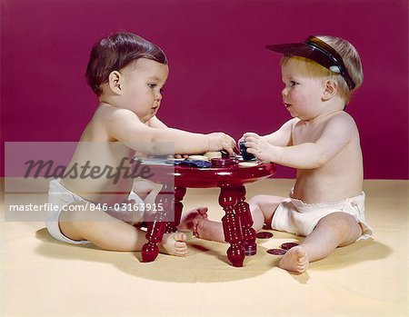 1960s TWO BABIES SITTING AT RED STOOL PLAYING CARDS POKER WITH GAMBLING CHIPS