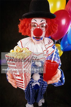 CLOWN WITH GLASSES AND HAT HOLDING POPCORN AND DRINK - Stock Photo -  Masterfile - Rights-Managed, Artist: ClassicStock, Code: 846-03164021