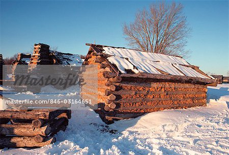 WINTER SNOW AROUND LOG CABINS AT VALLEY FORGE PENNSYLVANIA