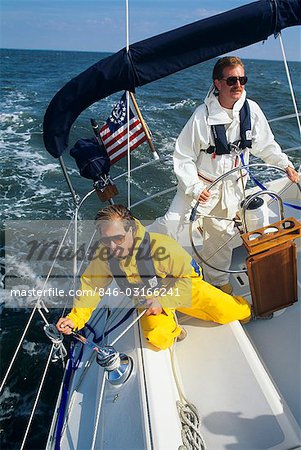 TWO MEN WEARING FOUL WEATHER GEAR ON SAILBOAT - Stock Photo - Masterfile -  Rights-Managed, Artist: ClassicStock, Code: 846-03166241