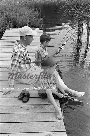 1990s Father And Son Fishing On Dock Tapestry by Vintage Images