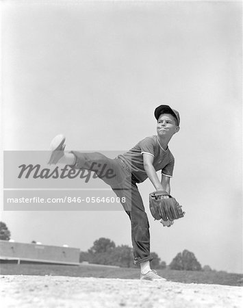 Silhouette Of A Baseball Pitcher Winding Up To Pitch Stock Photo