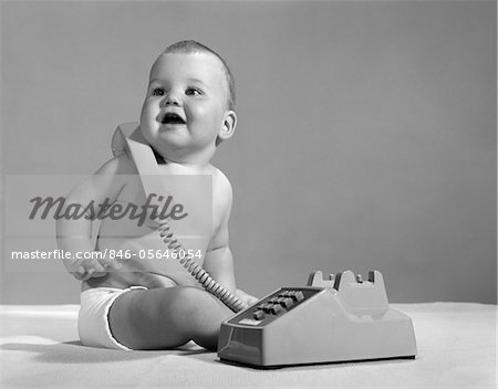 1960s - 1970s SMILING BABY IN DIAPER WITH TELEPHONE