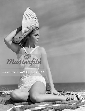 1930s - 1940s WOMAN IN WHITE BATHING SUIT ON BEACH WEARING BIG