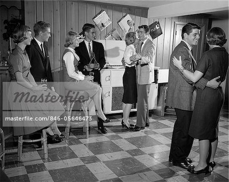1950s - 1960s TEEN COUPLES HAVING PARTY DANCING IN REC ROOM 1950s - 1960s TEEN COUPLES HAVING PARTY DANCING IN REC ROOM