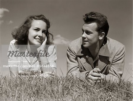 1940s TEENAGE COUPLE LYING IN GRASS ROMANCE BOY GIRL OUTDOOR ...