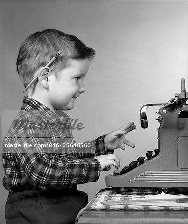Boy Typing On Old Typewriter Stock Photo - Download Image Now - Child,  Typewriter, Boys - iStock