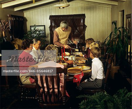 1980s THREE GENERATION FAMILY THANKSGIVING DINNER FATHER CARVING TURKEY