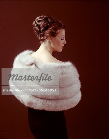 1970s WOMAN FROM BACK WEAR LIGHT COLOR FUR STOLE AROUND HER SHOULDERS