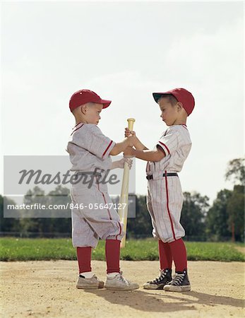 1960s TWO BOYS HOLDING BASEBALL BAT LITTLE LEAGUE UNIFORMS - Stock Photo -  Masterfile - Rights-Managed, Artist: ClassicStock, Code: 846-05647127