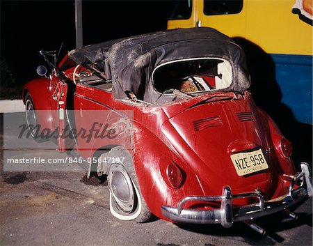1960s RED VOLKSWAGEN BUG BEETLE CONVERTIBLE CAR WRECK CRASH WRECKED RUIN DAMAGE AUTOMOBILE ACCIDENT