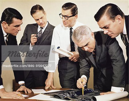 1960s BUSINESSMEN MEETING INSPECTING BLUEPRINTS Not for use with: Beer, Cigars, Cigarettes, Soap, Toothpaste, Mouthwash, Coffee, Tea, or Soft Drinks