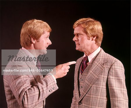 1970s ANGRY RED HAIRED MAN IN PLAID SUIT ARGUING WITH HIMSELF