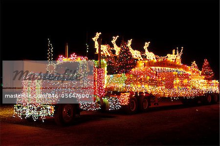 TRACTOR TRAILER TRUCK DECORATED WITH CHRISTMAS LIGHTS SANTA CLAUS REINDEER AND SLEIGH