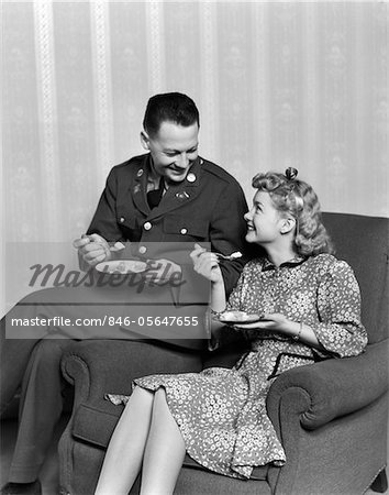 1940s SMILING COUPLE EATING DESSERT MAN IN ARMY UNIFORM