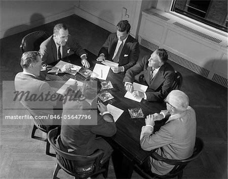 1950s - 1960s SIX BUSINESSMEN EXECUTIVES MANAGERS SALESMEN MEETING AROUND CORPORATE CONFERENCE TABLE