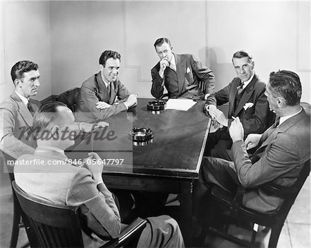 1930s - 1940s 6 BUSINESSMEN MEETING IN BOARDROOM AROUND TABLE WITH ASHTRAYS 1930s - 1940s 6 BUSINESSMEN MEETING IN BOARDROOM AROUND TABLE WITH ASHTRAYS