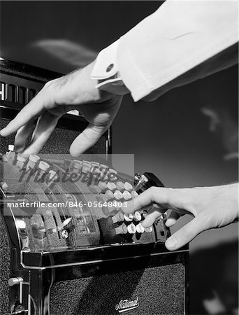 1930s MAN'S HANDS PUSHING BUTTONS ON CASH REGISTER