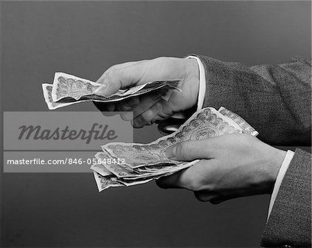 Hand holding retro styled money pouch, isolated on white Stock Photo