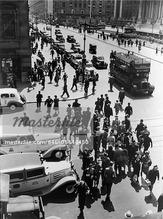 1930s PEDESTRIAN CROWD CROSSING INTERSECTION 42nd STREET & 5th AVENUE NYC CARS TAXIS DOUBLE DECKER BUSES STREET AERIAL VIEW