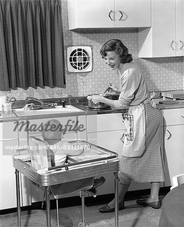 Mom and son in aprons play with flour while cooking at home in the kitchen  against the background of kitchen utensils. Selective focus. Portrait. Clos  Stock Photo - Alamy