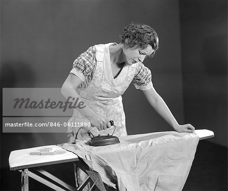 1,800+ Woman Ironing Cloth With Electric Iron Stock Photos