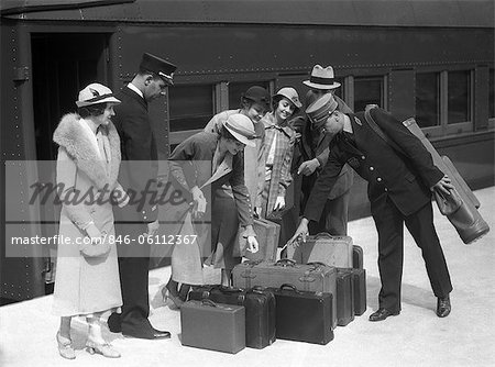 1920s 1930s TRAVELERS ON TRAIN PLATFORM IDENTIFYING LUGGAGE FOR
