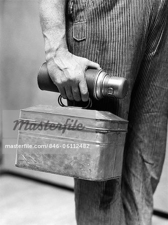 https://image1.masterfile.com/getImage/846-06112482em-1930s-worker-mans-hand-carrying-lunch-pail-thermos-bottle-stock.jpg