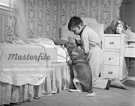 1950s BOY & DOG PRAYING AT BEDSIDE