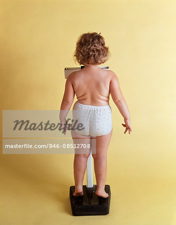 https://image1.masterfile.com/getImage/846-08512708em-1970s-overweight-chubby-little-girl-weighing-herself-on-scale-back.jpg