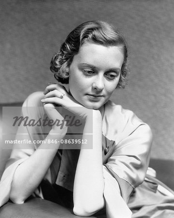 Premium Photo  Pensive woman sitting at table while thinking