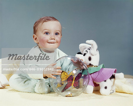 1960s WIDE-EYED BABY CHILD LOOKING AT CAMERA PLAYING WITH TOYS STUFFED ANIMAL AND PLASTIC BALL - Stock Photo - Masterfile - Rights-Managed, Artist: ClassicStock, Code: 846-09012842 1960s WIDE-EYED BABY CHILD LOOKING AT CAMERA PLAYING WITH TOYS STUFFED ANIMAL AND PLASTIC BALL - Stock Photo - Masterfile - Rights-Managed, Artist: ClassicStock, Code: 846-09012842