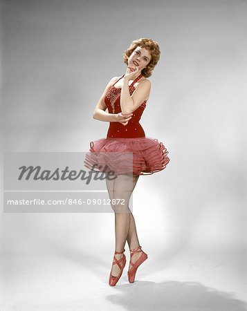 Transportere blødende Afskrække 1960s YOUNG SMILING BALLERINA DANCER RED TUTU POINT SHOES FISHNET STOCKINGS  RED HAIR - Stock Photo - Masterfile - Rights-Managed, Artist: ClassicStock,  Code: 846-09012872