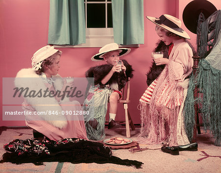 1950s THREE LITTLE GIRLS DRINKING MILK PLAYING ADULT DRESS UP IN OLD CLOTHES AND HATS