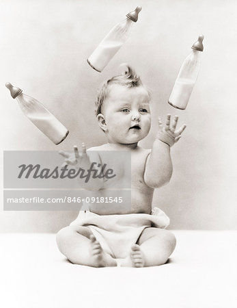 1930s BABY WEARING CLOTH DIAPER SITTING JUGGLING THREE GLASS BABY BOTTLES OF MILK