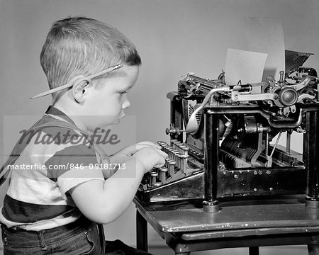 Boy Typing On Old Typewriter Stock Photo - Download Image Now - Child,  Typewriter, Boys - iStock