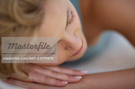 Extreme Close Up Of Girl With Wavy Blonde Hair Relaxing Stock