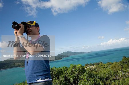 Tilted angle view of mountain range and ocean being  photographed by man,Australia