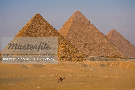 Men on camels beside the Pyramids,Giza,Cairo,Egypt