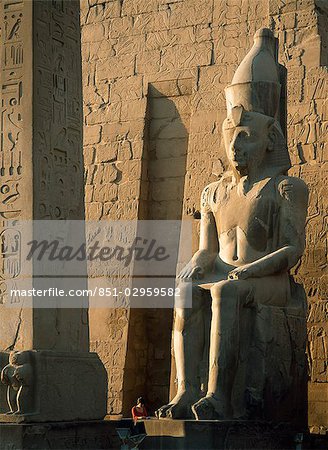 Tourist reading guidebook at obelisk,Luxor Temple,Luxor,Egypt