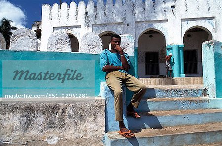 Man sitting on a wall,Lamu,Kenya.