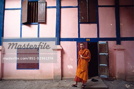 Monk leaving building,Laos