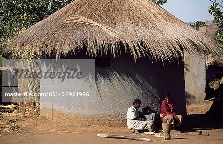 WOMEN OUTSIDE TRADITIONAL HUT,MALAWI