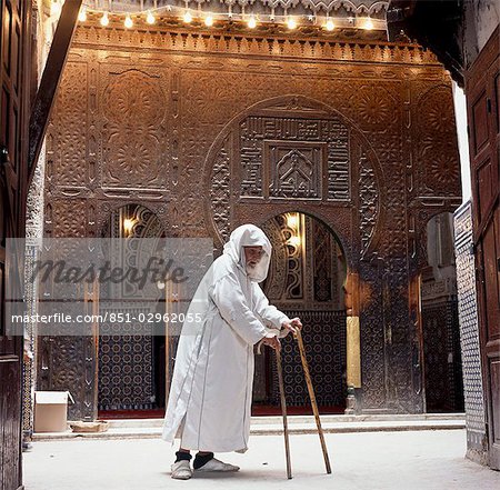 Old man with sticks,Fez,Morocco