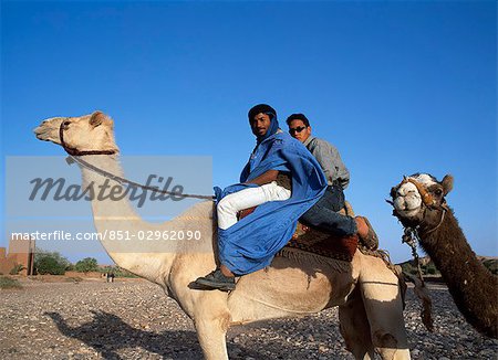 Camel riders nr the Ait Benhaddou,,The High Atlas,Morocco