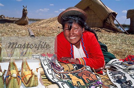 Uros Indian woman with artisan goods,Lake Titicaca,Peru
