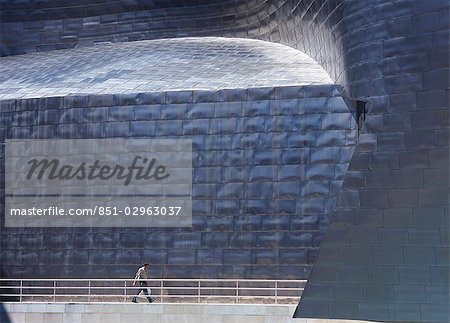 Man walking by Guggenheim Museum,Bilbao,Spain