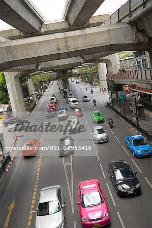Traffic on busy street below flyovers,Bangkok,Thailand