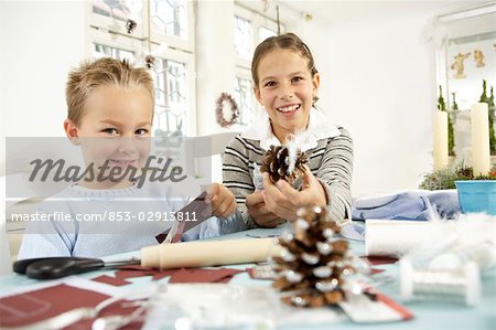 Two children doing crafts